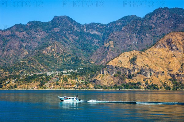 Lake Atitlan framed by volcanoes