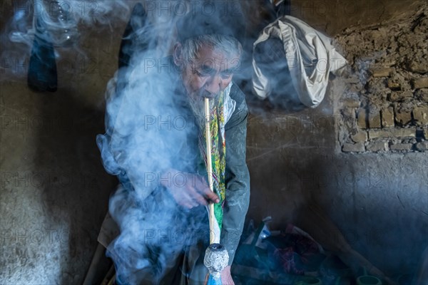 Sufi man smoking marihuana