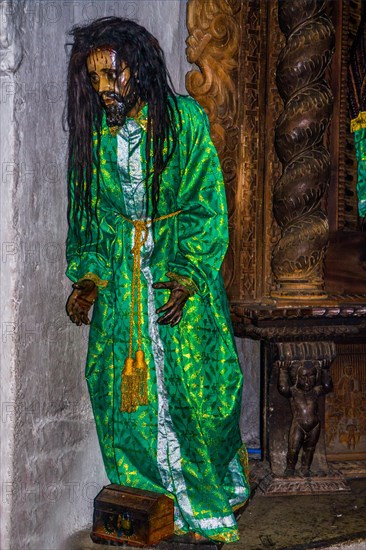 Wooden figure of Jesus with real hair