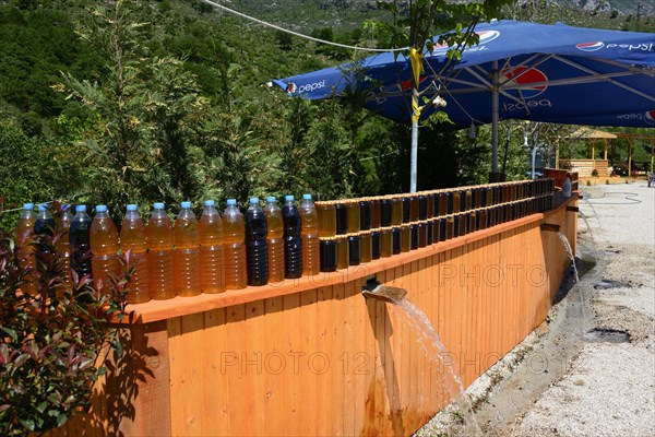 Spring water cools olive oil and honey