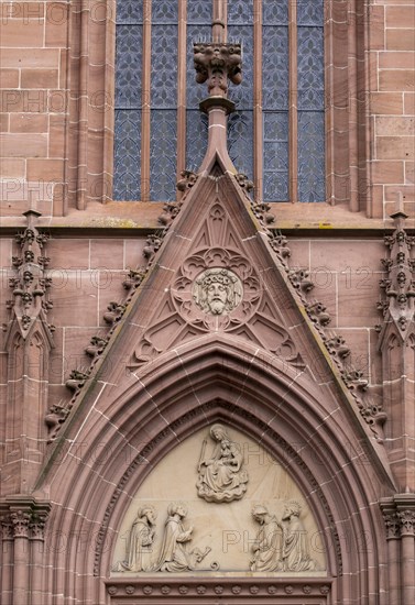 Depictions of saints above the portal of the Catholic Church of junglefowl (Gallus)