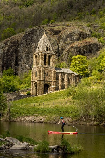 Notre Dame des Chazes church on the River Allier with canoeists