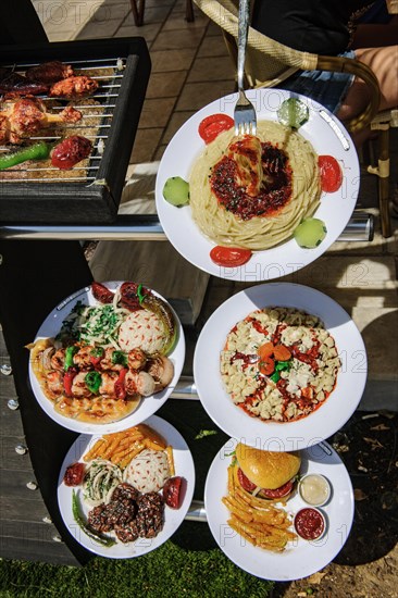 Exhibition of examples of dishes in front of restaurant on harbour promenade