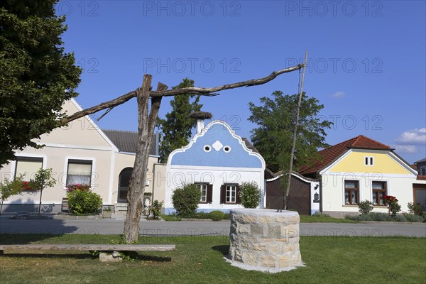 Hufnagl House with stork's nest and draw well