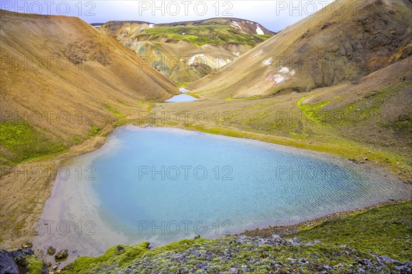 Turquoise lake at the foot of Brennisteinsalda