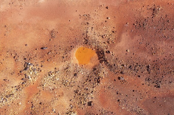 Little pool and extremely mineral-rich ground in the area of the Rio Tinto mines