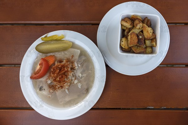 Brawn served with fried potatoes in a beer garden