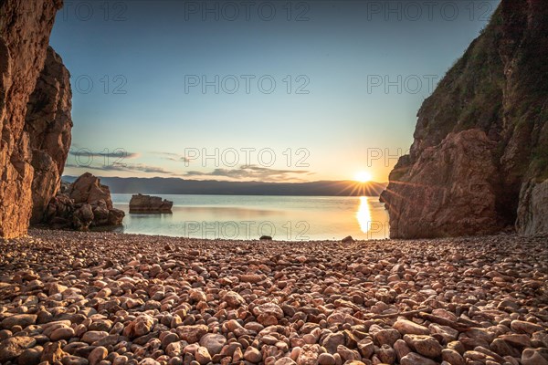 A small stone beach by the sea