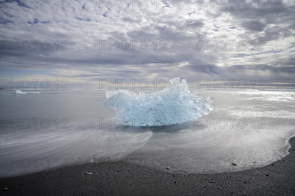 Iceberg on the black lava beach Diamond beach