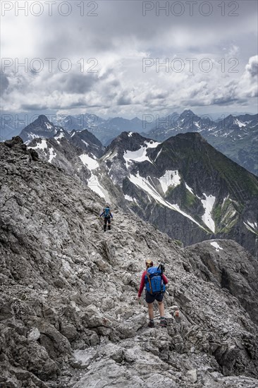 Hiker on a path on the rock