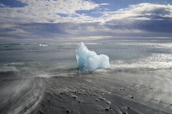 Iceberg on the black lava beach Diamond beach