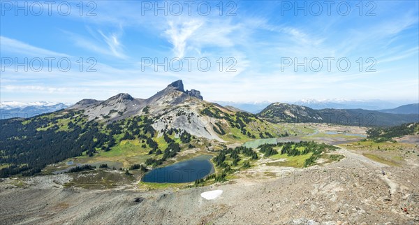 Blue lakes in front of Black Tusk volcanic mountain