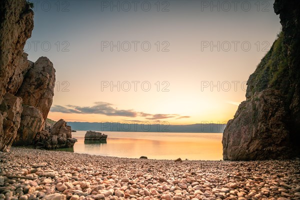 A small stone beach by the sea