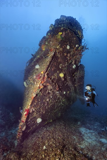 Divers at the bow of tugboat