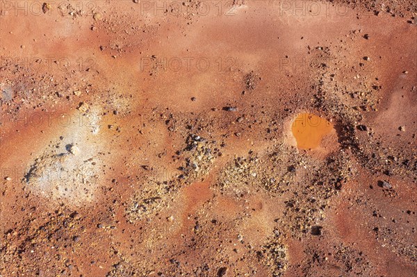 Little pool and extremely mineral-rich ground in the area of the Rio Tinto mines