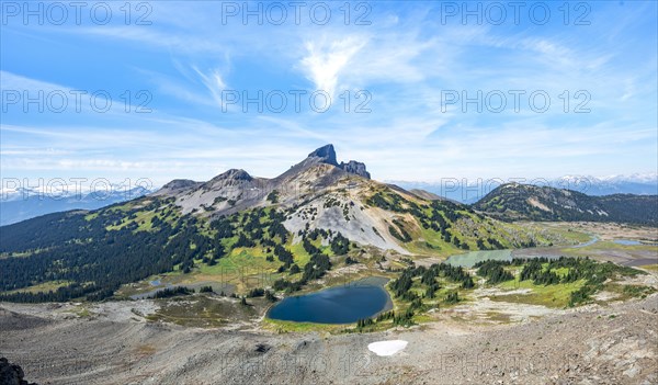 Blue lakes in front of Black Tusk volcanic mountain