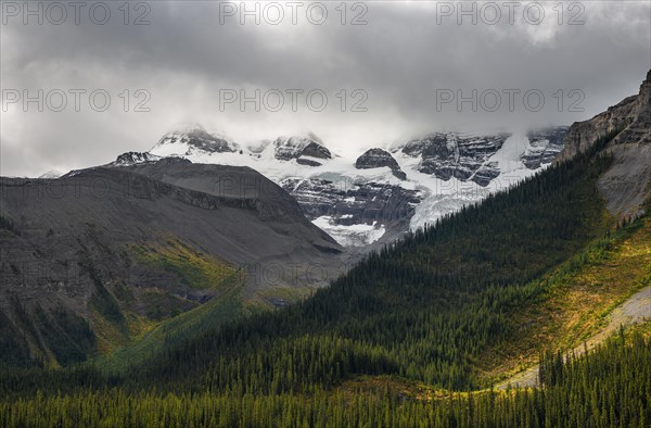 Cloudy snow-capped peaks