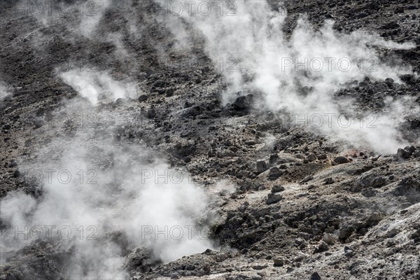 Steaming black volcanic soil