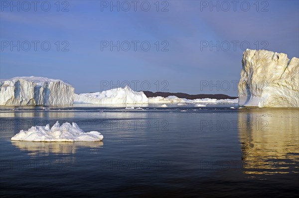 Icebergs reflected in the water