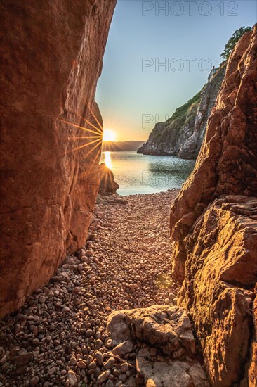 A small stone beach by the sea