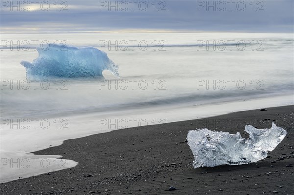 Icebergs on the black lava beach Diamond beach