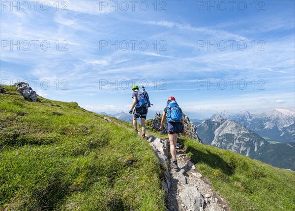 Mountaineers hiking on the via ferrata Mittenwalder Hoehenweg