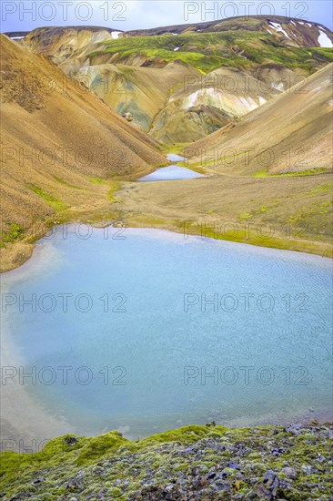 Turquoise lake at the foot of Brennisteinsalda