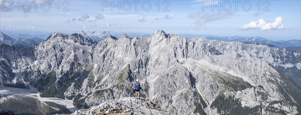 Hiker with helmet looking at mountains