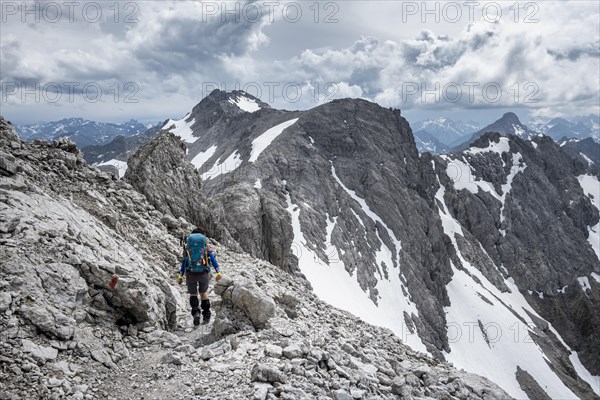 Hiker on a path on the rock