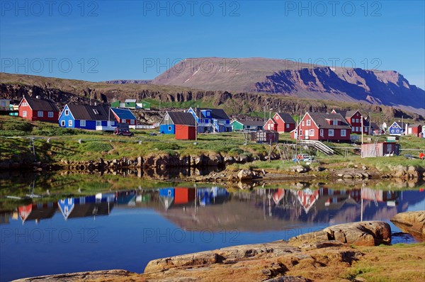 Wooden houses reflected in the water