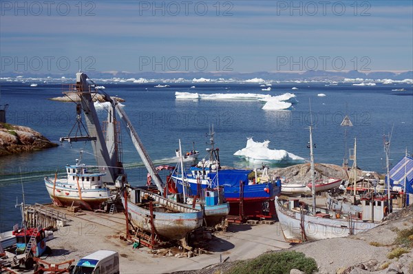 Fishing boats lying on dry land