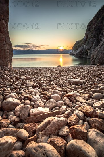 A small stone beach by the sea