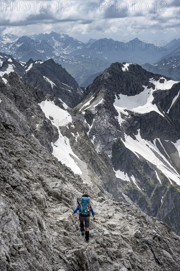 Hiker on a path on the rock