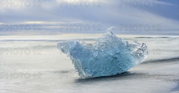 Iceberg on the black lava beach Diamond beach