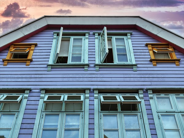 Traditional colourful wooden house in the evening