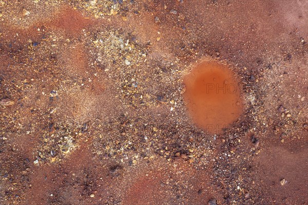 Little pool and extremely mineral-rich ground in the area of the Rio Tinto mines