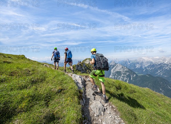 Mountaineers hiking on the via ferrata Mittenwalder Hoehenweg