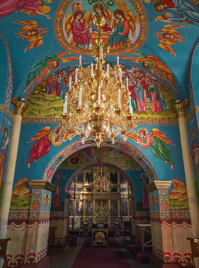 Beautiful painted walls and ceiling inside the Capriana Monastery