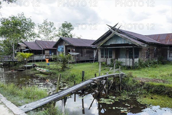 Jungle village with wooden huts on the Sekonyer River