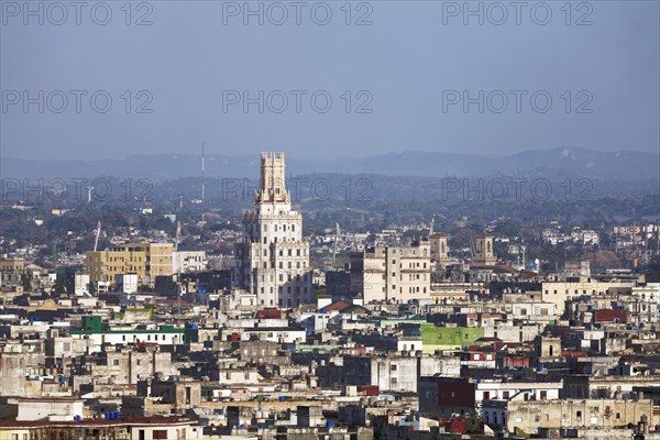 View over sea of houses with tower of the Cuban telephone company