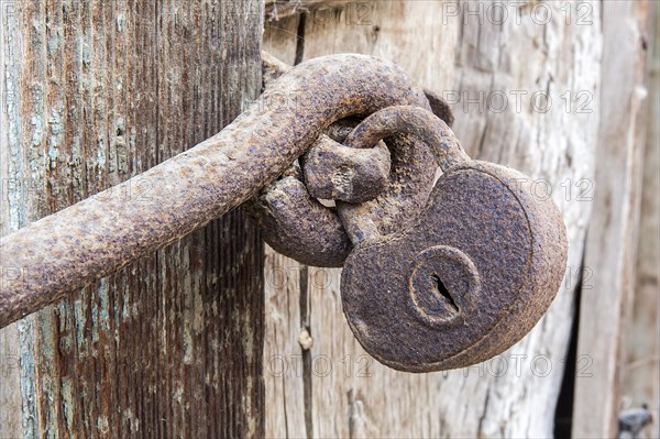 Macro view of a very old rusty padlock