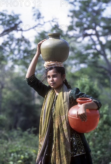 Indian girl carrying water in the jug