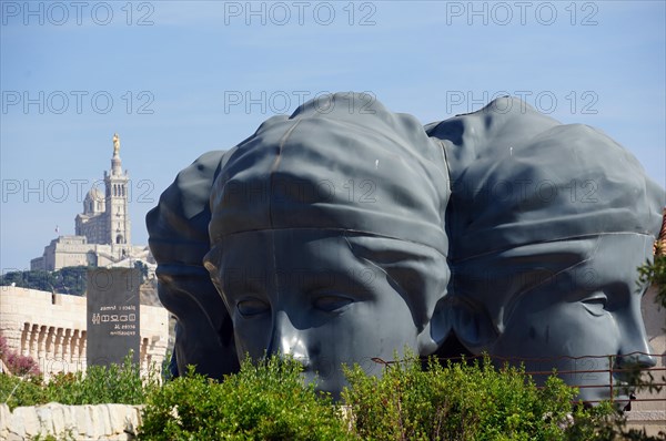 Sculpture with three heads