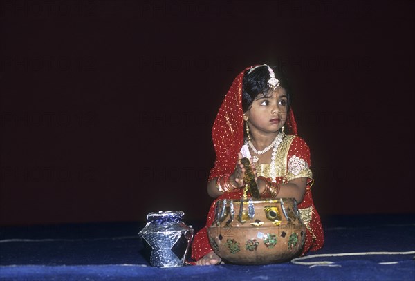 A girl in costumes in a religious festival of Krishna Janmashtami