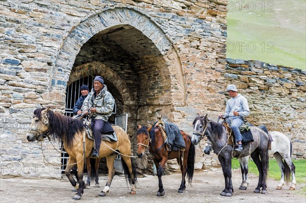 Horsemen in front of Tash Rabat