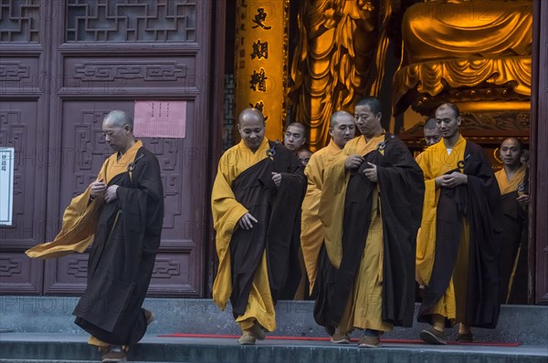 Devout monks leaving a temple