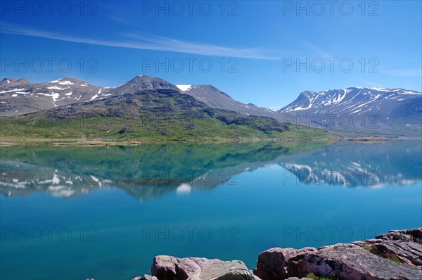 Mountains reflected in the fjord