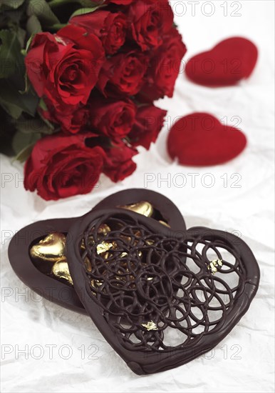 VALENTINE'S DAY CHOCOLATE HEART WITH A RED ROSE