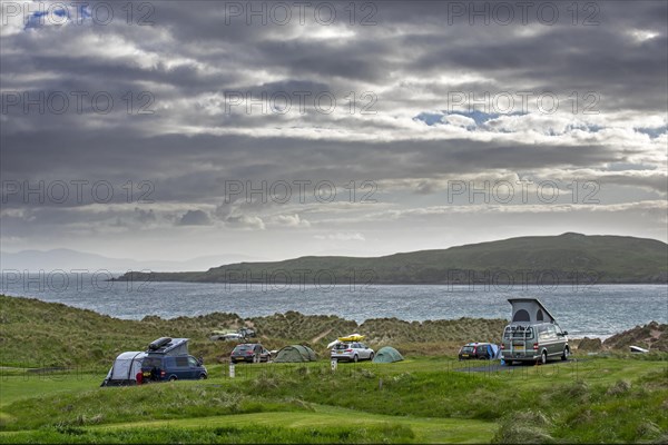 Campervans and tents at Loch Gairloch campsite