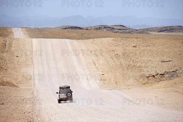 Car on road C14 between Solitaire and Kuiseb Pass